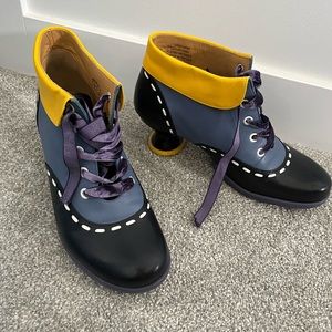 Fluevog ankle boots. Black, with colored accents of purple and yellow. Size 9.5